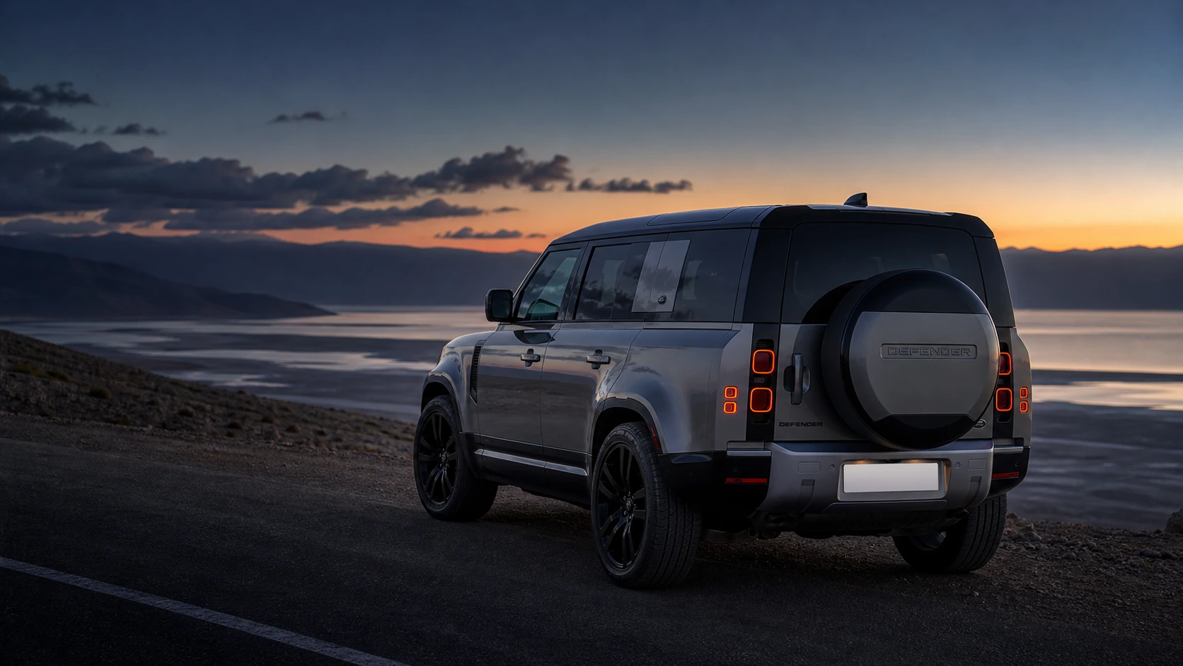 2024 Land Rover Defender 110 on the Dead Sea road at blue hour