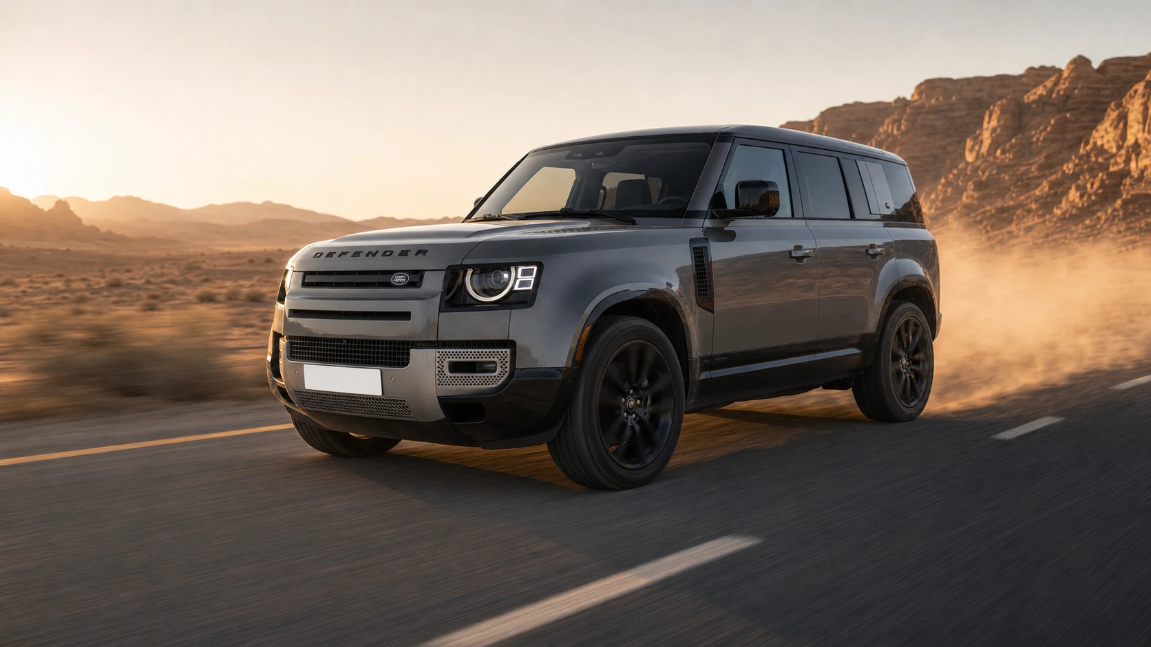 2024 Land Rover Defender 110 driving a southern Jordan desert road