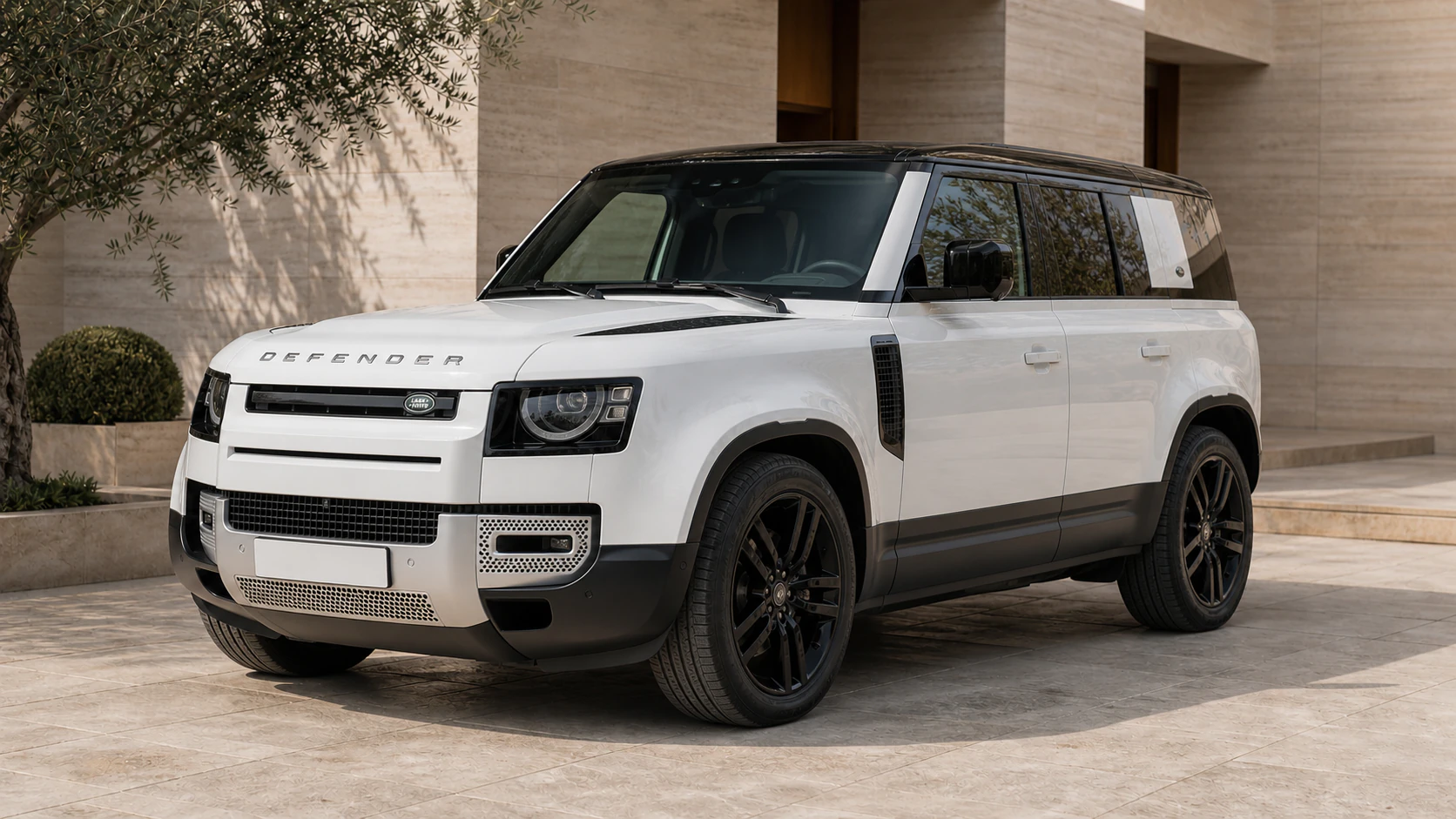 2025 Land Rover Defender 110 in Fuji White in an Amman limestone courtyard