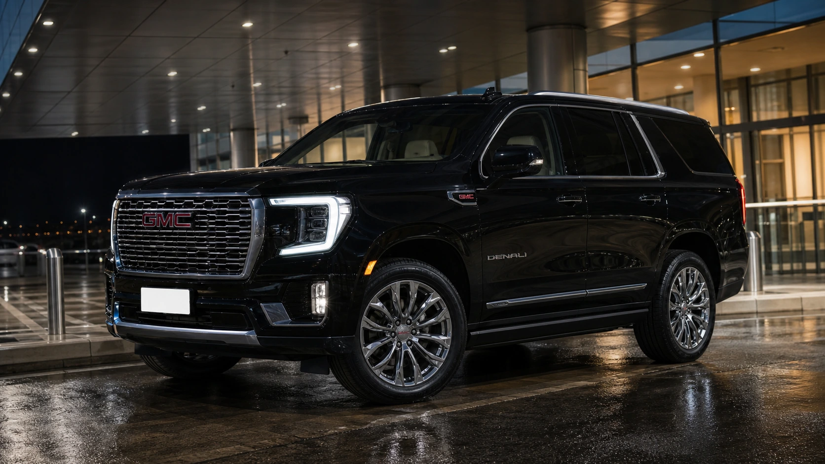 2023 GMC Yukon Denali at an executive pickup lane at night