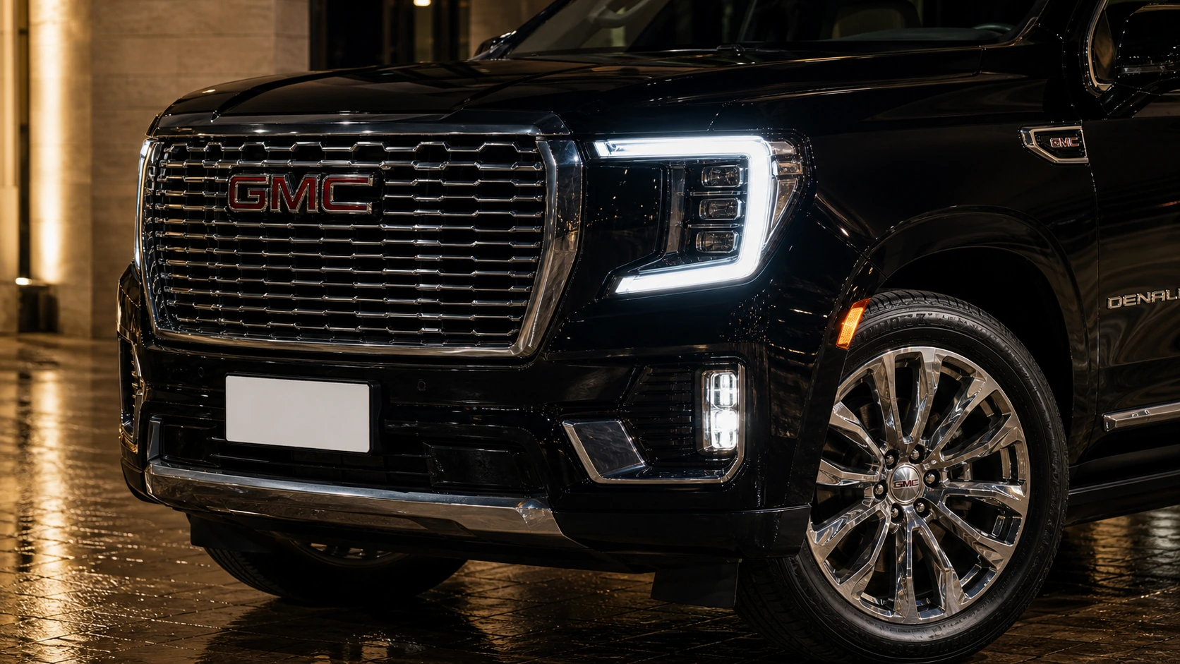 2023 GMC Yukon Denali chrome grille detail at night