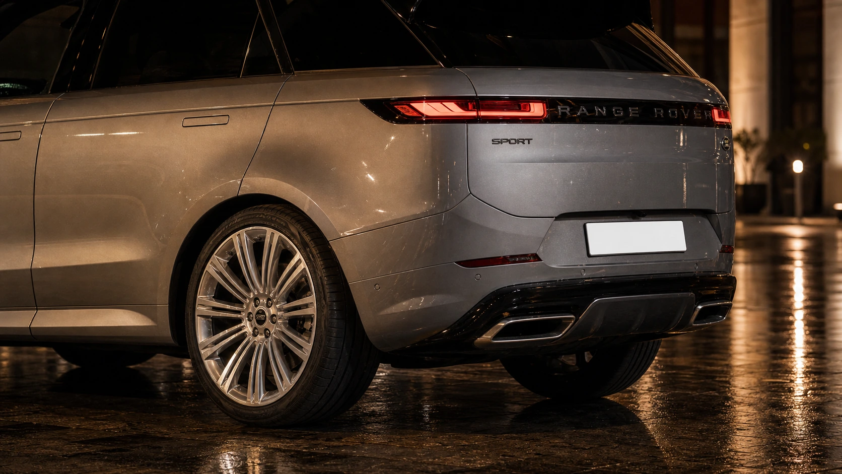 2024 Range Rover Sport rear detail on wet stone
